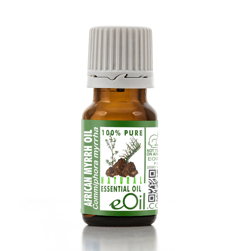 Bottle of African Myrrh essential oil with a green label on a white background