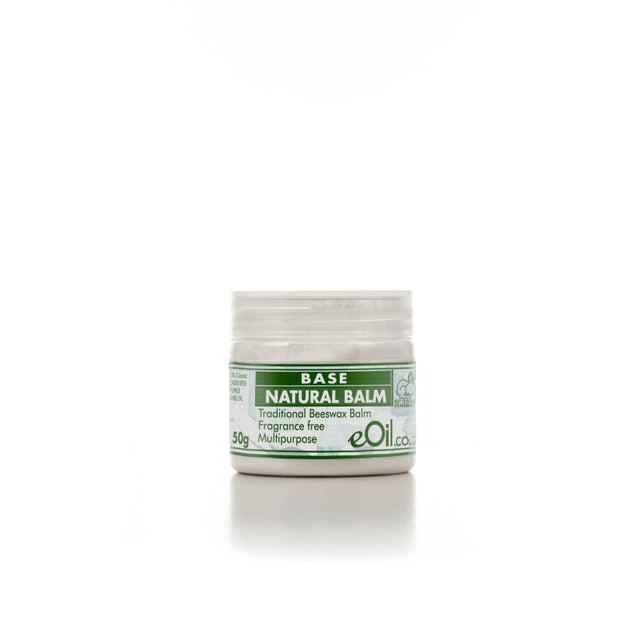 A small open jar of Base Natural Balm, with a label that indicates it is a beeswax based balm for multiple uses, in a 50g size, and fragrance-free.