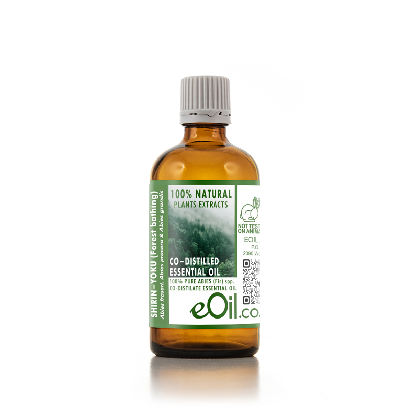 An amber glass bottle of eOil.co Shifen-Yoku (forest bathing) essential oil with a green and white label, set against a plain white background.