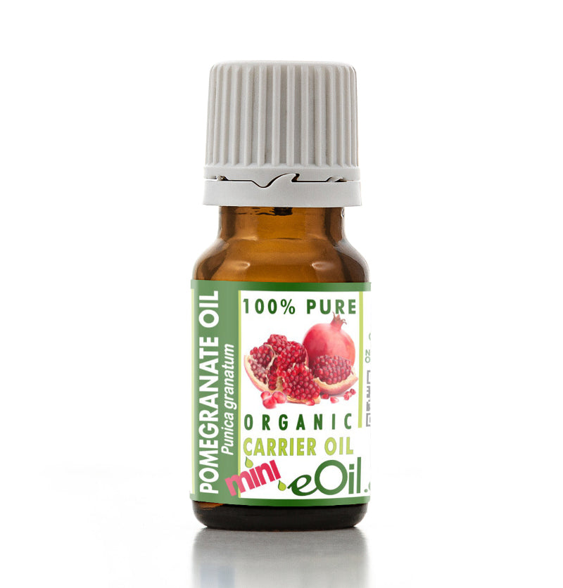 Bottle of pomegranate oil with a green label on a white background