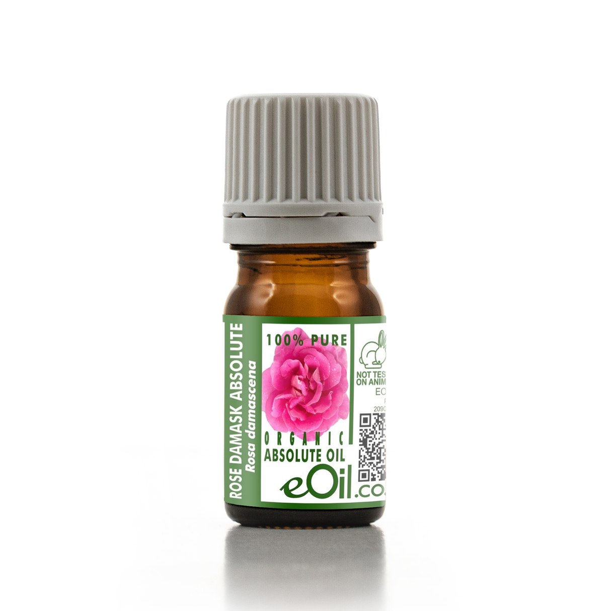 A small amber glass bottle of rose damask absolute oil with a ribbed gray cap and a green-and-white label featuring a pink rose and the brand name eOil.
