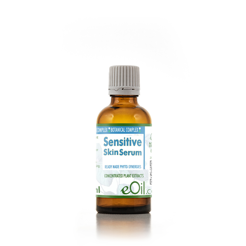 eOil Complex Sensitive Skin Serum in an amber glass bottle with a gray ribbed cap and a white label with blue and green text, set against a plain white background.
