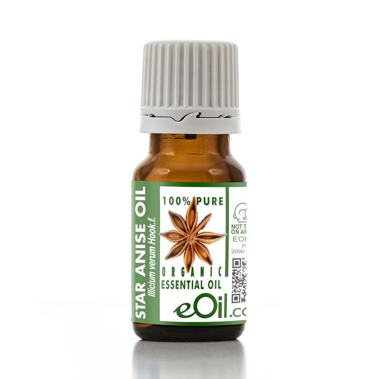 Bottle of star anise essential oil with a green label on a white background