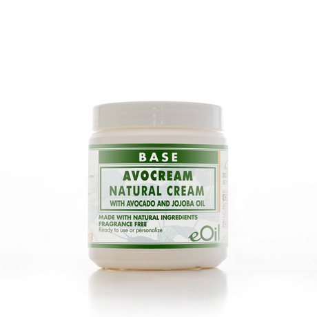 A white plastic jar of eOil Base Avocream Natural Cream with a green and white label, set against a clean white background with a soft reflection.