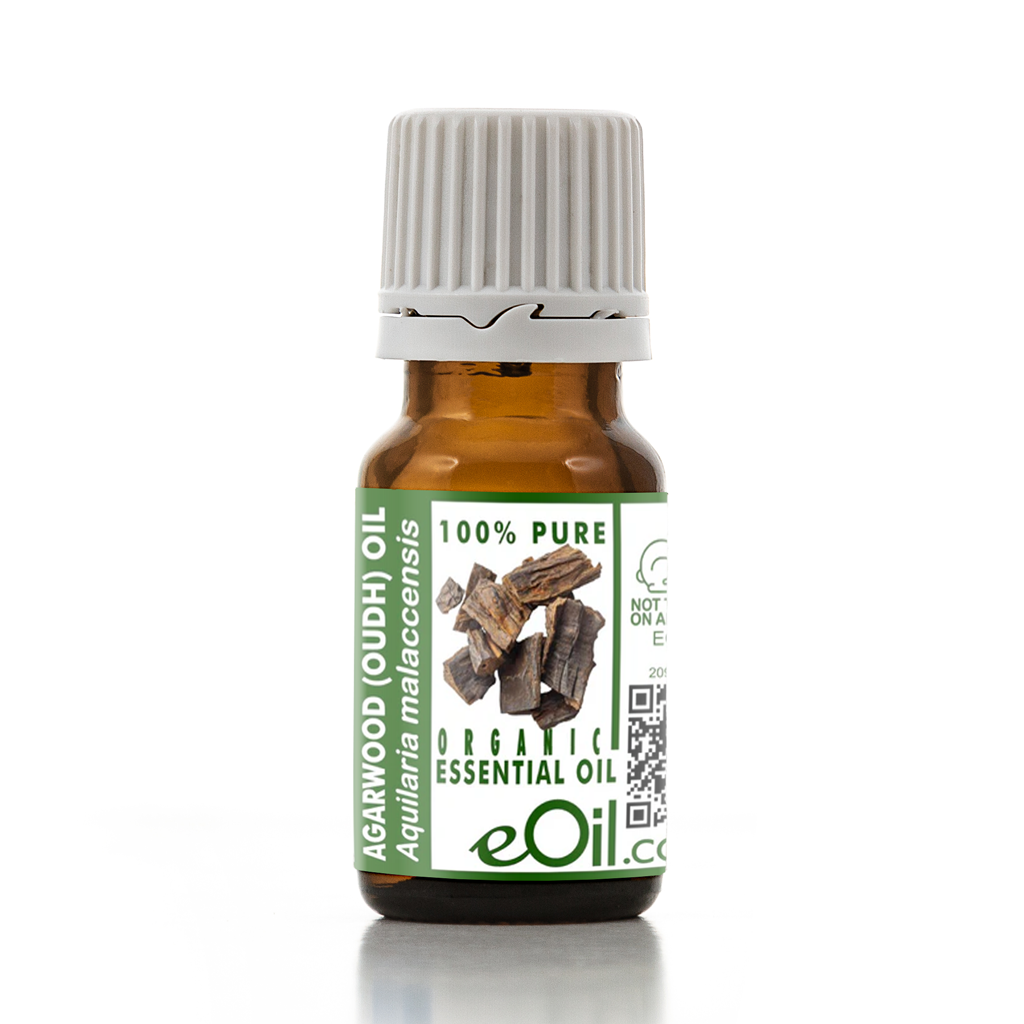 Bottle of Agarwood Toudhi essential oil with a green label on a white background