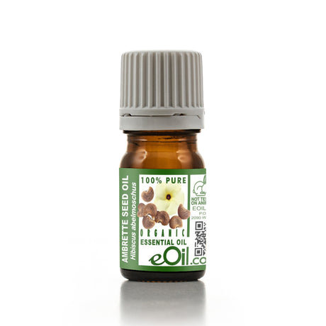A bottle of Ambrette Seed Oil with a green label on a white background