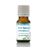 A small amber glass bottle of eOil Anti Aging Skin Serum with a white ribbed cap, shown on a clean white background with a soft reflection.