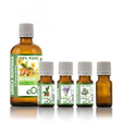 Set of Arnica Montana macerated oil and four other essential oil bottles with labels on a white background.