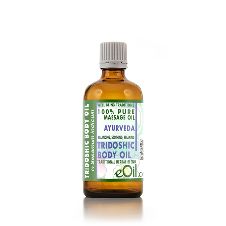A 100% pure Ayurvedic Tridoshic Body Oil in an amber glass bottle with a white ribbed cap, featuring a green and white label with purple text.