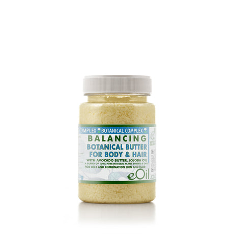 Jar of balancing botanical butter for body and hair on a white background