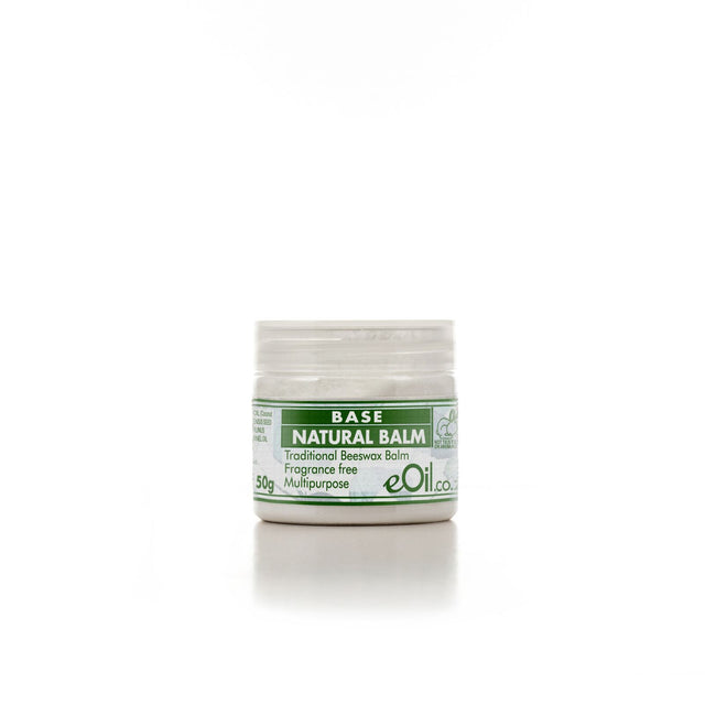A small open jar of Base Natural Balm, with a label that indicates it is a beeswax based balm for multiple uses, in a 50g size, and fragrance-free.