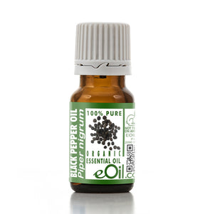 Bottle of black pepper essential oil with a green label on a white background