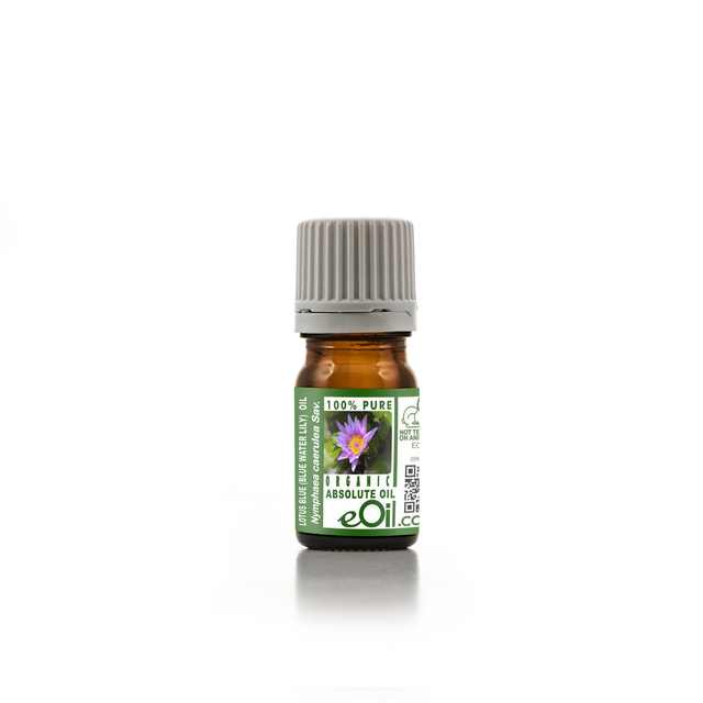 Small bottle of blue lotus absolute oil with a green label on a white background