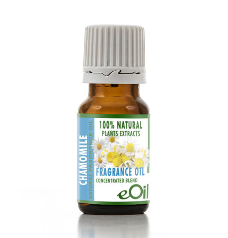 A small amber glass bottle of chamomile fragrance oil with a white ribbed cap and a blue, green, and white label featuring chamomile flowers. The brand eOil is visible at the bottom of the label.