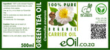 Label of organic green tea oil with branding and product details.