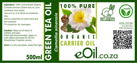 Label of organic green tea oil with branding and product details.