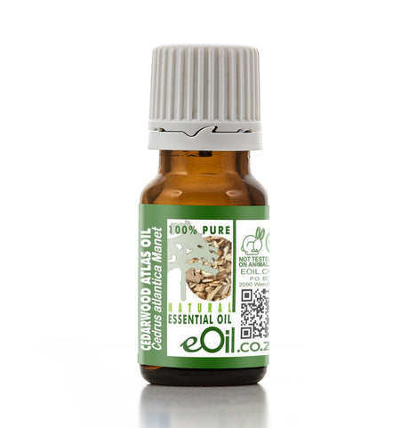 Bottle of Cedarwood Atlas essential oil with a green label on a white background