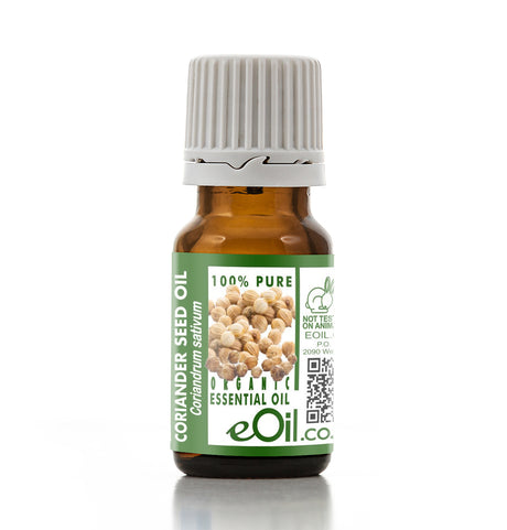 Bottle of coriander seed essential oil with a green label on a white background