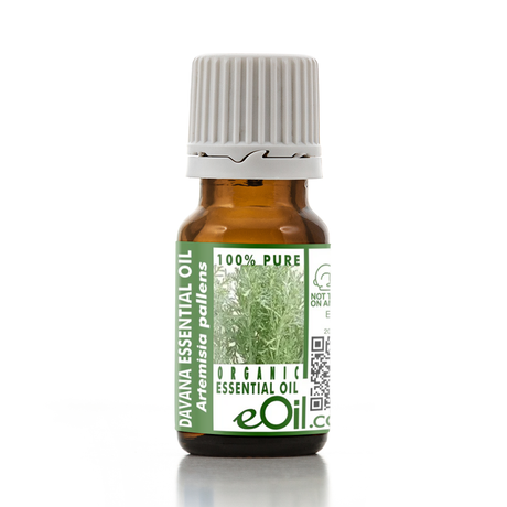 Bottle of Davana essential oil with a green label on a white background