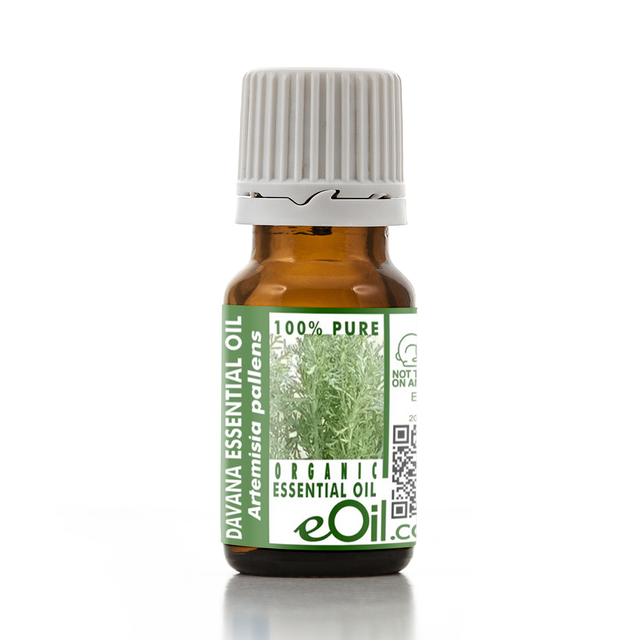 Bottle of Davana essential oil with a green label on a white background