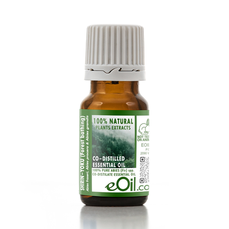 A small amber glass bottle of eOil Co. Shrivn-Odu (Forest Bathing) essential oil with a white ribbed cap and a green label, set against a plain white background.