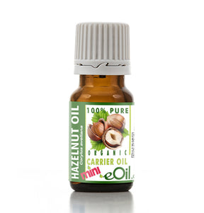 Bottle of hazelnut oil with a green label on a white background