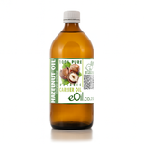 Bottle of hazelnut oil with a label on a white background 500 ml