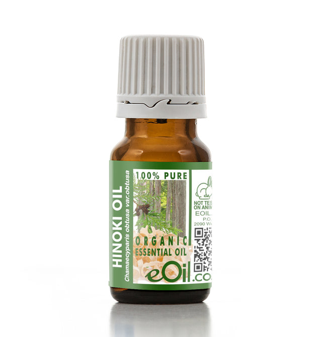 Bottle of Hinoki oil with a green label on a white background