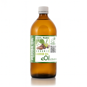 Bottle of Jojoba oil with a green label on a white background