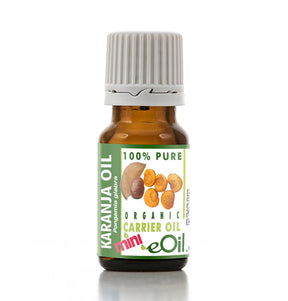 Bottle of Karanja oil with a green label on a white background