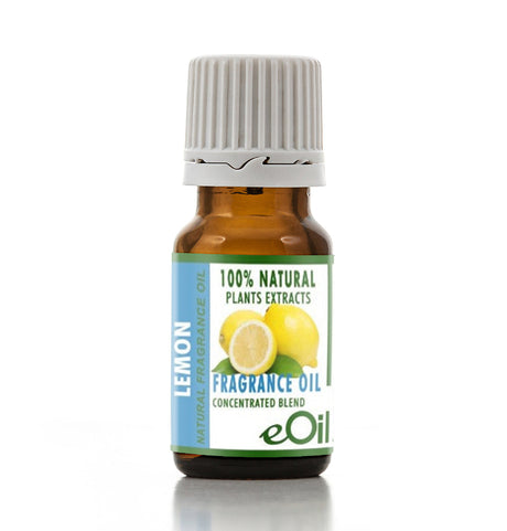 A small amber glass bottle of eOil Lemon Fragrance Oil with a white ribbed cap, featuring a label with lemon illustrations and text indicating natural fragrance oil.