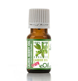 Bottle of Laurel Berry Oil with a green label on a white background