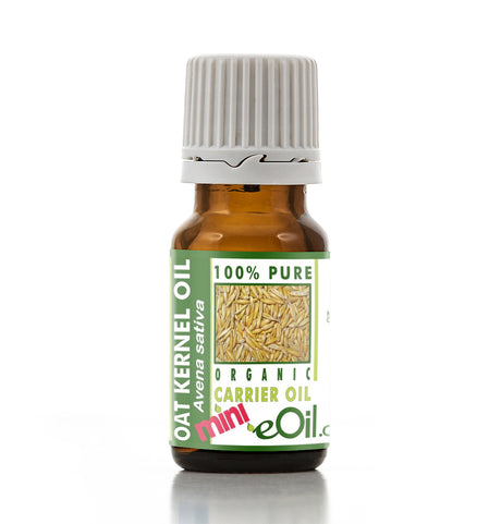 Bottle of oat kernel oil with a green label on a white background