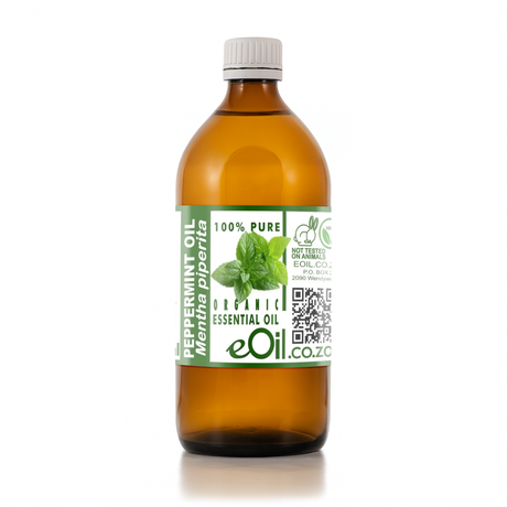 Bottle of peppermint essential oil with a label on a white background