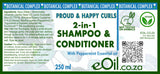 Label of a 2-in-1 shampoo and conditioner with botanical complex and vegan certification.