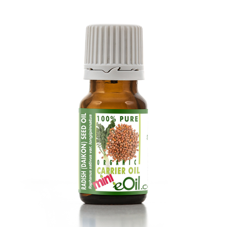 A small amber glass bottle of eOil brand Radish (Daikon) Seed Oil carrier oil with a white ribbed cap and a green and white label featuring a radish illustration.