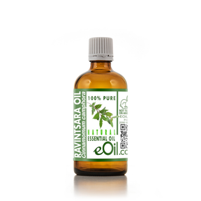 Bottle of Ravintsara essential oil with a green label on a white background