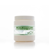 Jar of Rhassoul Clay with a green label on a white background 500