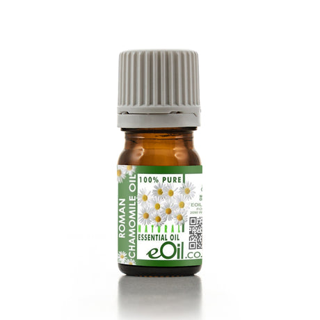 Bottle of Roman Chamomile essential oil with a green label on a white background