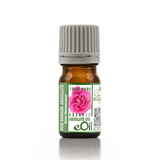 A small amber glass bottle of rose damask absolute oil with a ribbed gray cap and a green-and-white label featuring a pink rose and the brand name eOil.