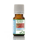 A small amber glass bottle of eOil Sandalwood Natural Fragrance Oil with a white ribbed cap and a green and blue label, set against a plain white background.