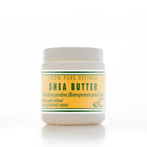 Jar of shea butter with a white lid on a white background