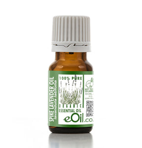 Bottle of spike lavender essential oil with a green label on a white background
