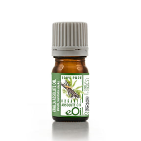 Bottle of vanilla absolute oil with a green label on a white background