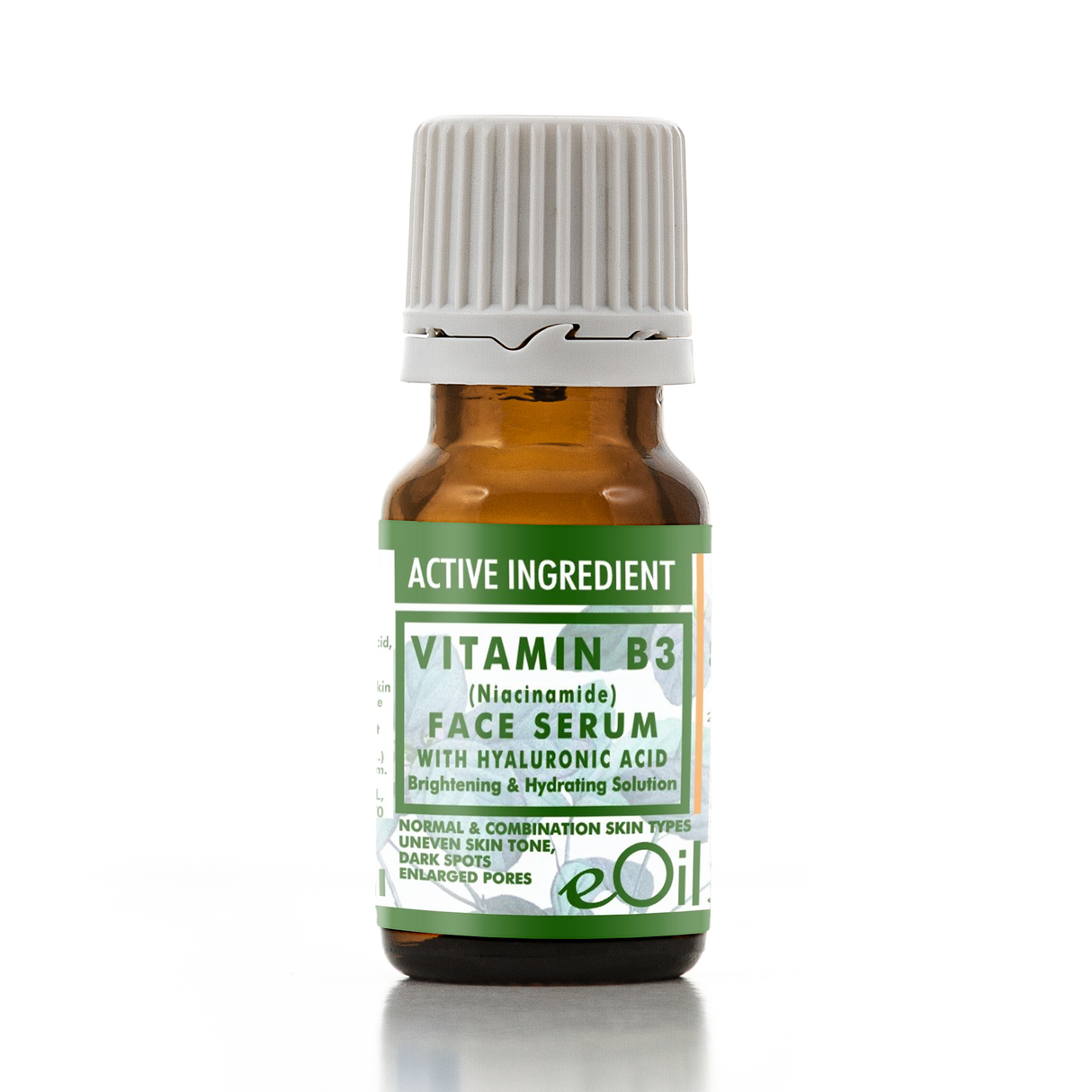 A small amber glass bottle of eOil Vitamin B3 Face Serum with a white ribbed cap and a green and white label, shown on a white background with a soft reflection.