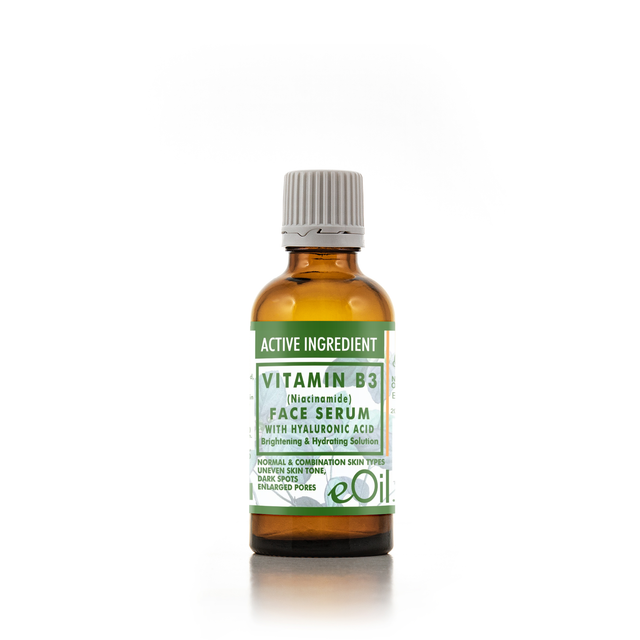 An amber glass bottle of eOil Vitamin B3 Face Serum with a white and green label and a gray ribbed cap, set against a plain white background.