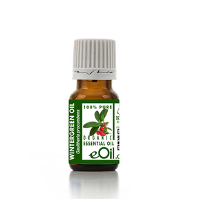 Bottle of wintergreen oil with a green label on a white background