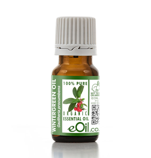 Bottle of wintergreen essential oil with a green label on a white background