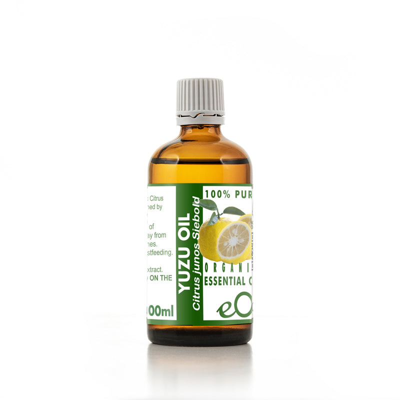 Bottle of Yuzu oil with a green label on a white background 100 ml
