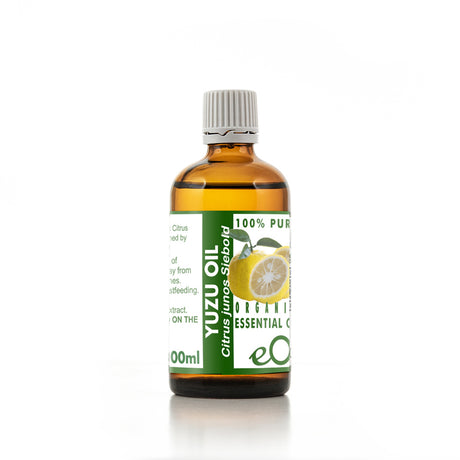 Bottle of Yuzu oil with a green label on a white background 100 ml